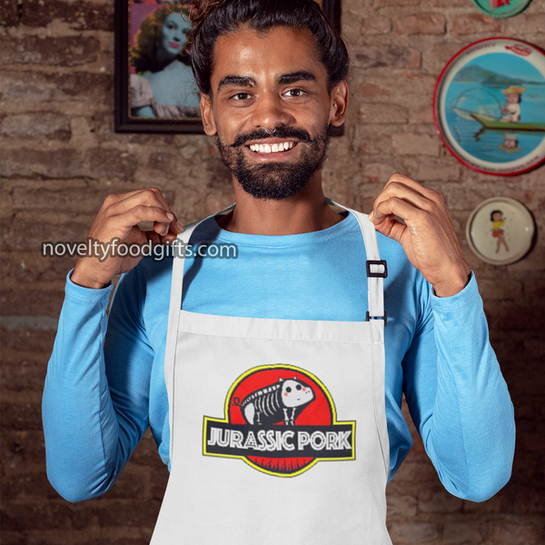 https://www.noveltyfoodgifts.com/cdn/shop/products/jurassic-pork-park-grill-dinosaur-meat-bbq-apron-mens-unisex-white-4-wm_grande.png?v=1657837766